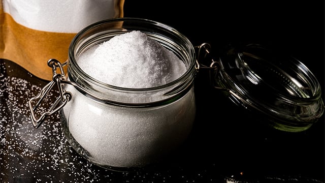 Sugar in glass jar container