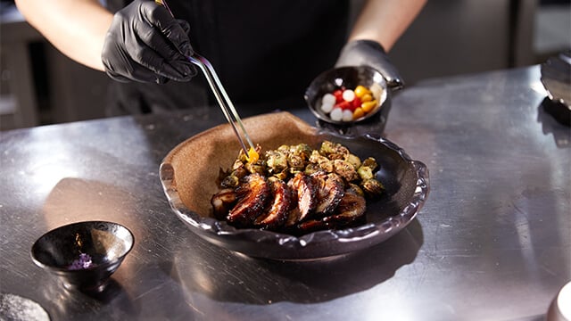 man plating food