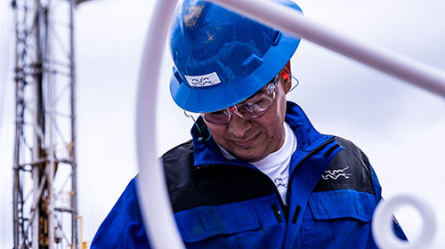 oil refinery worker looking down